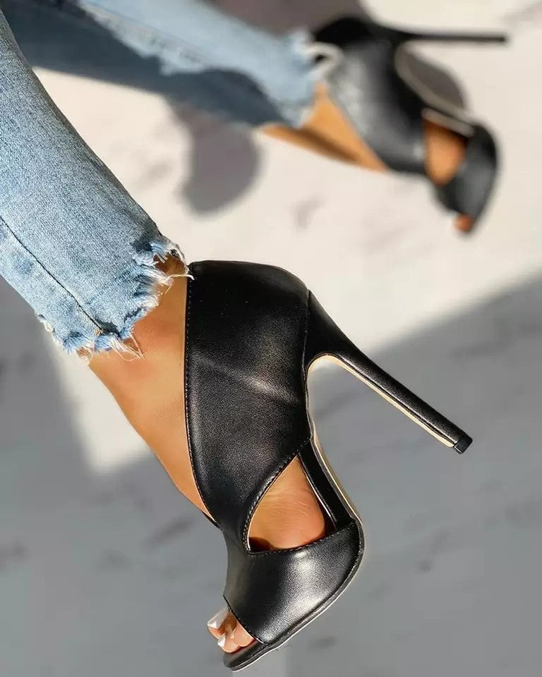 Black stiletto heels with peep-toe and sculpted cut-out design, high 11 cm heel